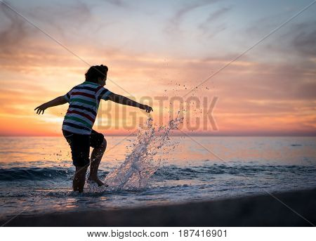 Happy boy enjoying the beach