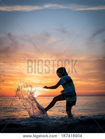 Happy boy enjoying the beach