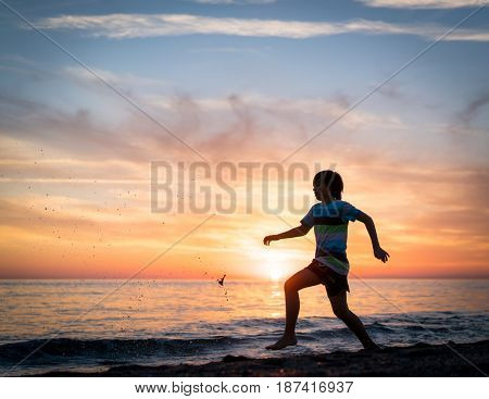 Happy boy enjoying the beach