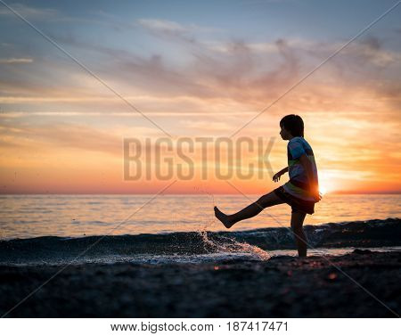 Happy boy enjoying the beach