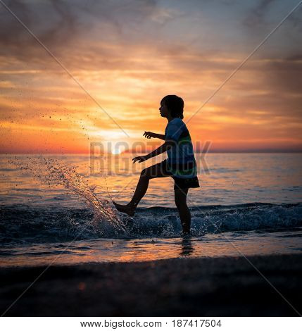 Happy boy enjoying the beach