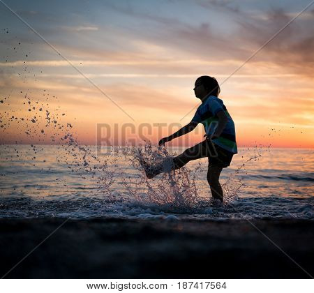 Happy boy enjoying the beach