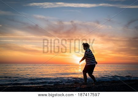 Happy boy enjoying the beach
