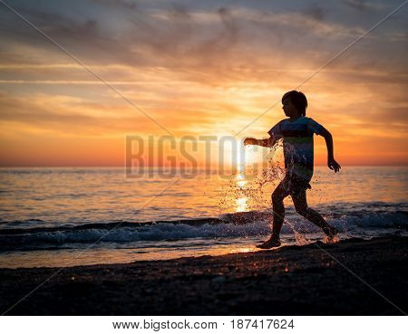 Happy boy enjoying the beach