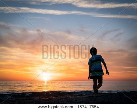 Happy boy enjoying the beach