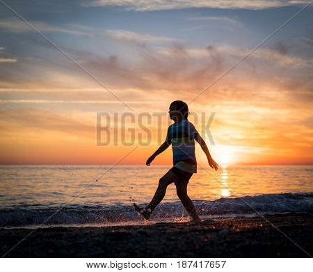 Happy boy enjoying the beach