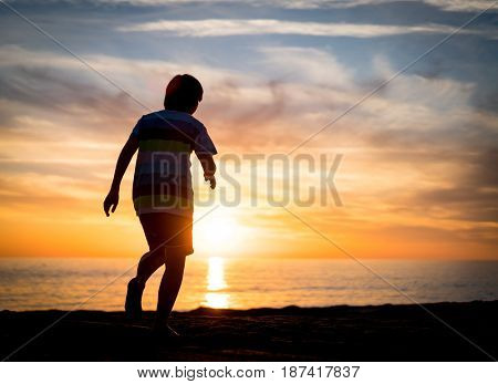 Happy boy enjoying the beach
