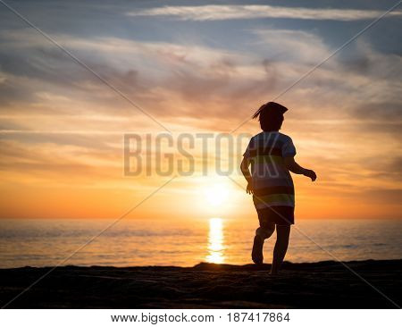 Happy boy enjoying the beach