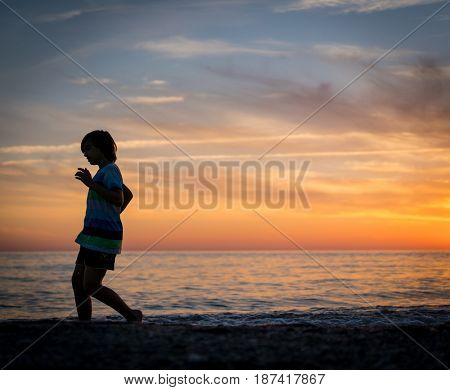 Happy boy enjoying the beach