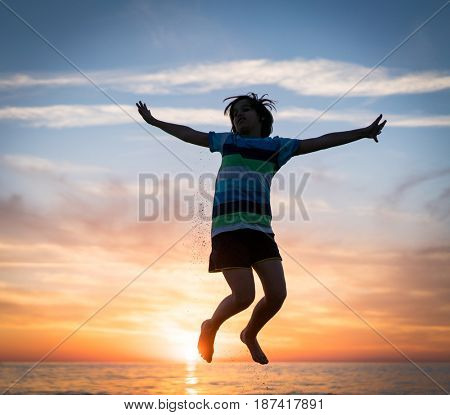 Happy boy enjoying the beach