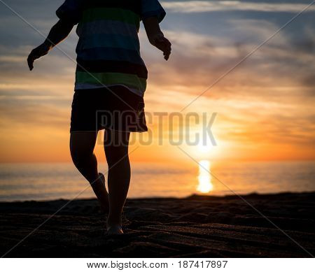Happy boy enjoying the beach