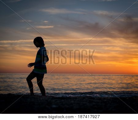 Happy boy enjoying the beach