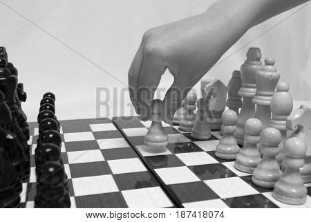 Chess. Beginning of the game.The chess pieces are placed on the chessboard. Black and white. First step.