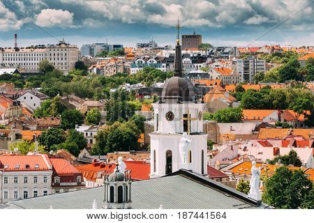 Vilnius, Lithuania. Bell Tower Near Cathedral Basilica Of St. Stanislaus And St. Vladislav At Sunny Summer Day. Beautiful View Of Old Town Under Dramatic Sky. Vilnius Old Town Is Part Of UNESCO World Heritage