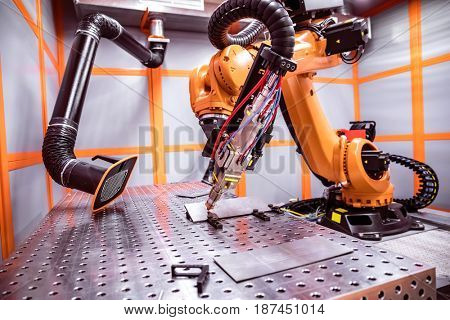 Fibre laser robotic remote cutting system. CNC Laser plasma cutting of metal, modern industrial technology.