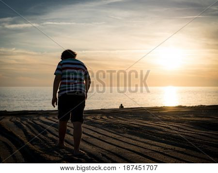 Happy boy enjoying the beach