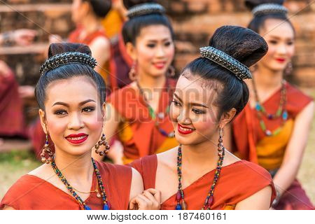 KALASIN THAILAND - FEBRUARY 20 2016: Girl dancers with local dress doing Thai Northeastern traditional dance at Yaku Pagoda to celebrate Buddism event in Kalasin