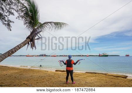 Labuan,Malaysia-Feb 19,2017: woman ready to having fun doing snorkel watersport activity in Papan island of Labuan,Malaysia.