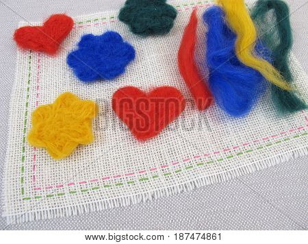 Felted figures from coloring dryer felting wool