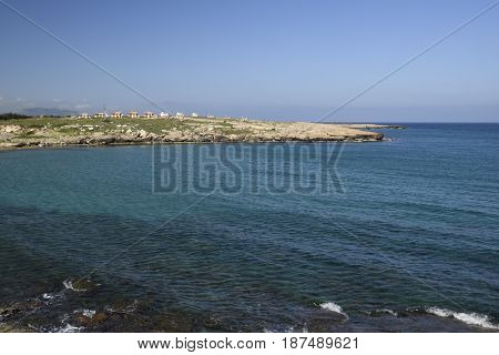 Blue clear water and blue sky outside the village Lapta in the North of Cyprus