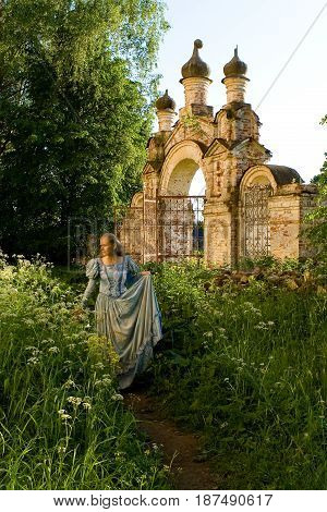 The girl is walking along the old abandoned Chernyshev estate. Russia.
