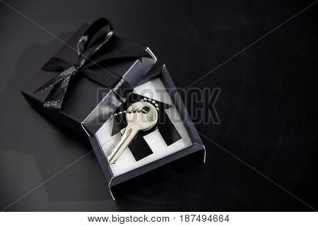 Black gift box with apartment keys - own housing