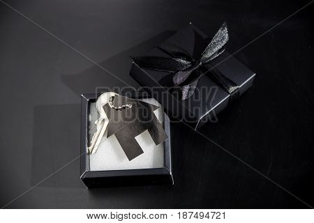 Black gift box with apartment keys - own housing