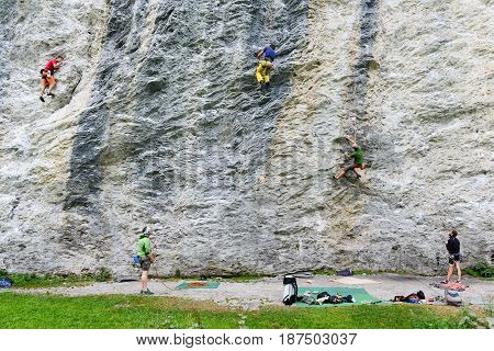 People Climbing On The Rock At Engelberg