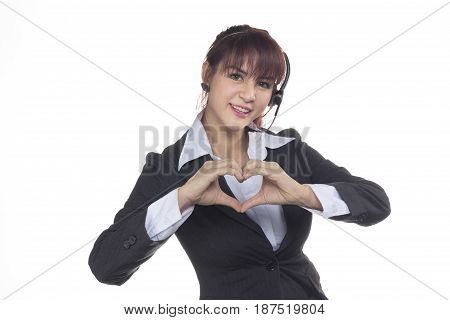 Call center woman smiling business woman customer Service Agent with headset isolated on a white. Customer Service Agent are showing in love sign heart shape during a telephone conversation.