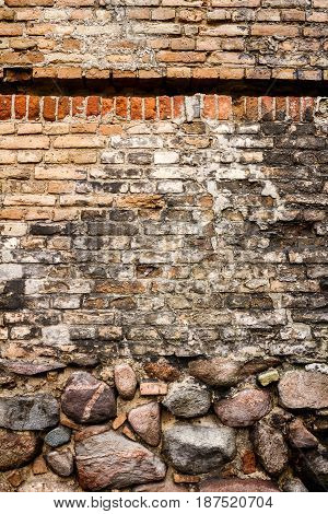 Yellow brick wall background with stone basement