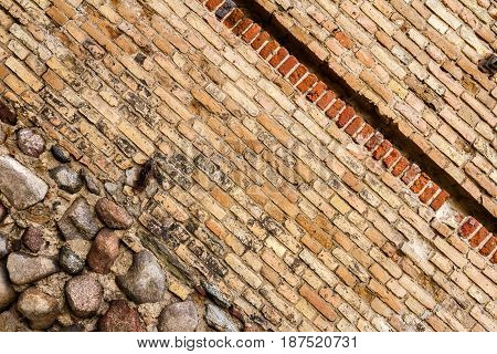 Yellow brick wall background with stone basement
