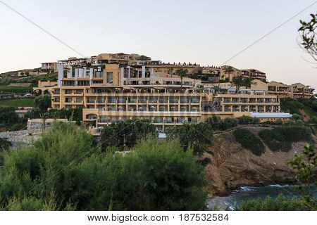AGIA PELAGIA GREECE - JULY 16 2016: Crete. Village Mononaftis. The popular five-star hotel Sea Side Resort on the hillside. Evening. Twilight.