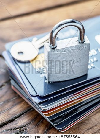 Credit cards and simle mechanical lock. Security concept.