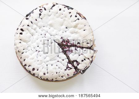 Tender homemade baking blueberry pie with lilac and tea