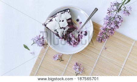 Tender homemade baking blueberry pie with lilac and tea