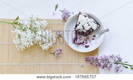 Tender homemade baking blueberry pie with lilac and tea
