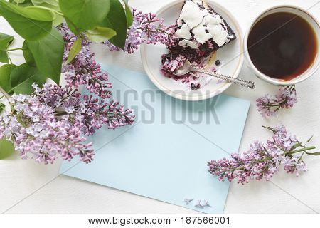 Tender homemade baking blueberry pie with lilac and tea