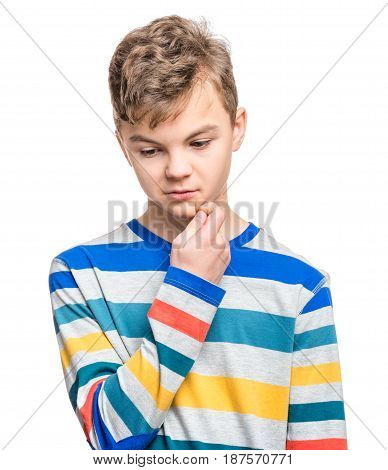 Casual thinking guy - caucasian male model. Half-length emotional portrait of teen boy. Thoughtful teenager, isolated on white background. Handsome smart serious ponder child.