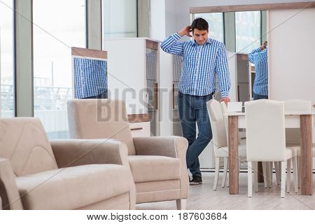 Young man shopping in furniture store