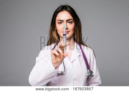 Woman Young Doctor With Syringe On Grey Background