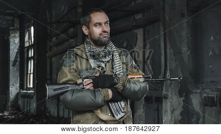 photo of man in uniform with a weapon