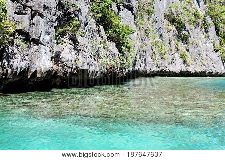 View From A Boat Of  Palm Cliff Beach And Rock