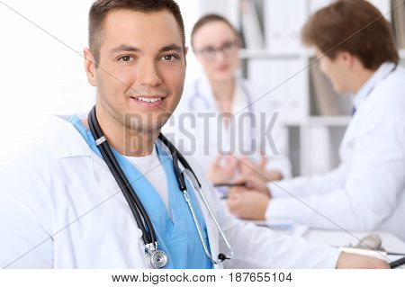 Happy doctor woman  with medical staff at the hospital