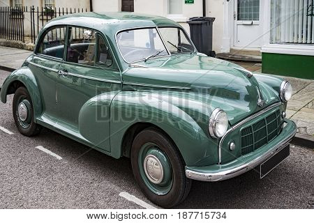 CORSHAM - UNITED KINGDOM - JULY 17: Vintage Classic Morris Minor in small village in south of England on July 17 2015 in Corsham UK