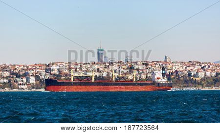 The tanker ship crosses the Bosporus on the background of Uskudar.