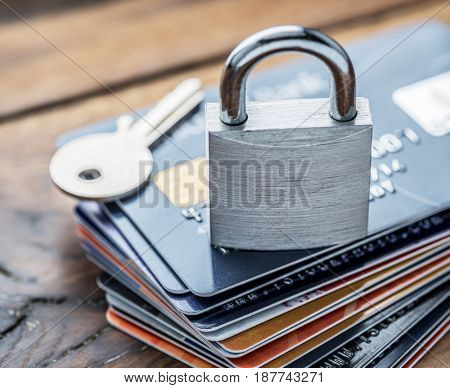 Credit cards and simle mechanical lock. Security concept.
