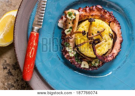 Grilled Seafood Octopus on Saffron Risotto with Brown Shimeji Mushrooms