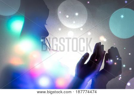 Muslim woman hands up for prying,  colorful  and  vintage tone filter effect color style.