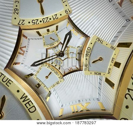 Modern classic golden watch clock hex abstract fractal spiral. Watch clock unusual abstract texture fractal pattern background. Incredible clock roman arabic numerals clock hands. Watch spiral effect