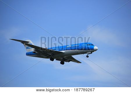 Amsterdam the Netherlands - July 21st 2016: PH-KZP KLM Cityhopper Fokker F70 approaching Polderbaan runway at Schiphol Amsterdam Airport arriving from Basel Switzerland